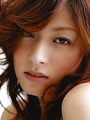 Red-haired Japanese girl Karen Kisaragi in white panties fondles her hairy pussy