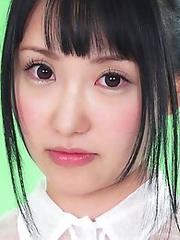 On the green screen Reina ran her hands across her see through outfit