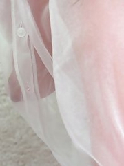 On the green screen Reina ran her hands across her see through outfit