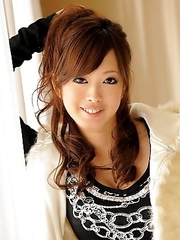 Emiri Seo poses in a room on floor