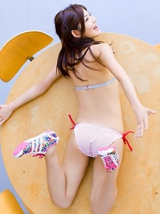 Rika Sato shows leering curves in colorful bath suits